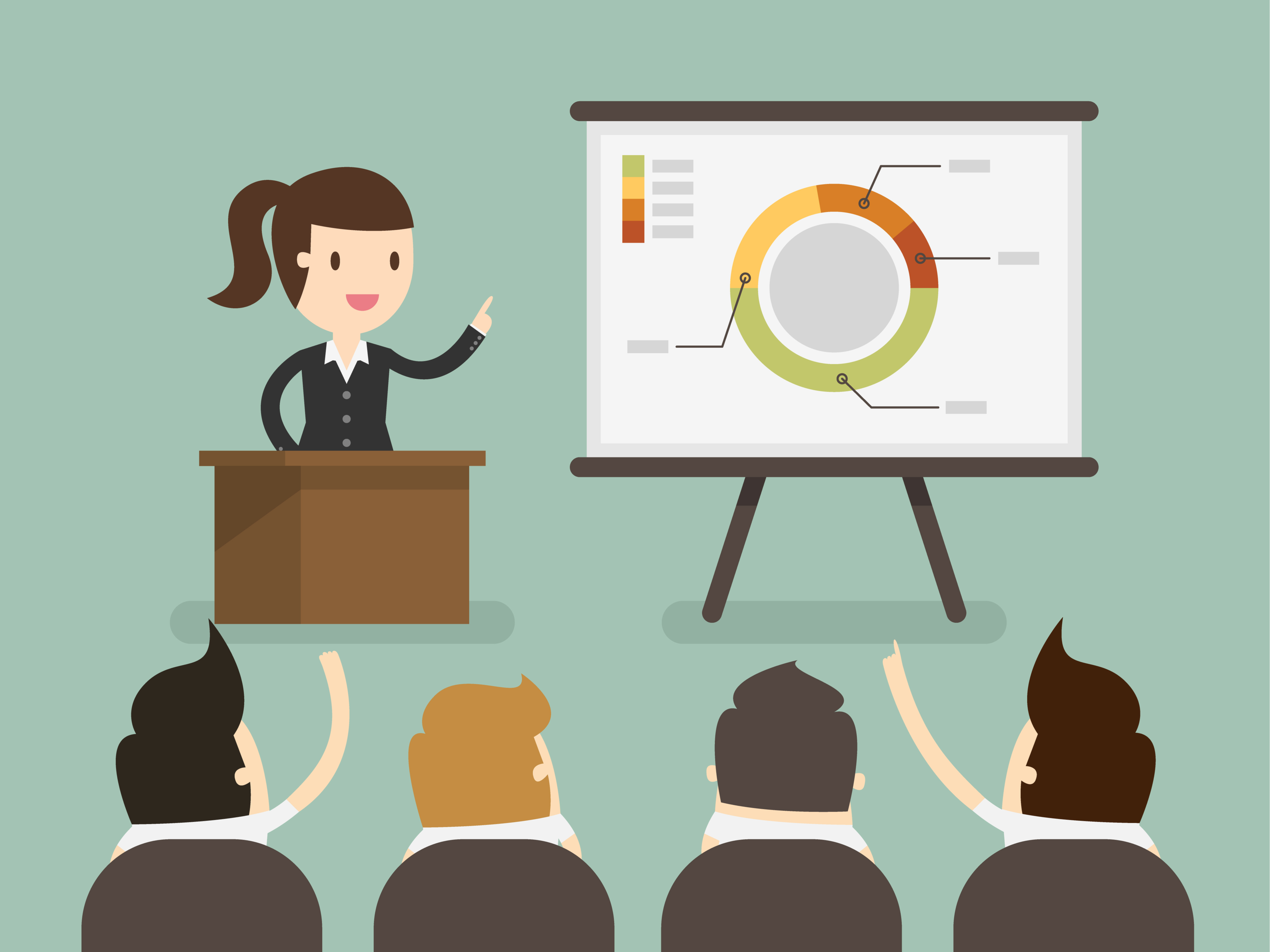 A female presenter pointing at displayed presentation slides containing a pie chart and arow of people sitting facing her.